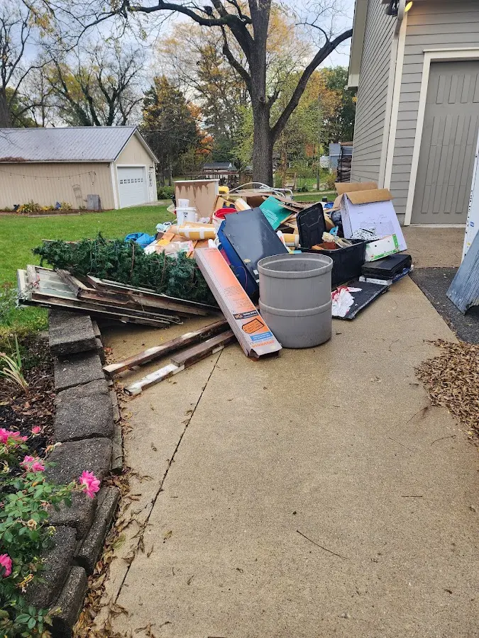 Dumpster being loaded with debris for Residential Dumpster Rental in Ocean Springs